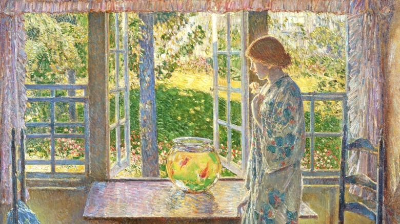 woman in kitchen with goldfish