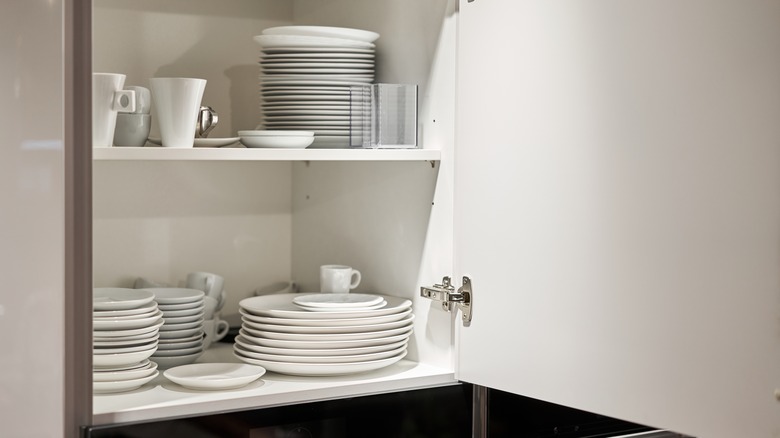 Plates in kitchen cabinet