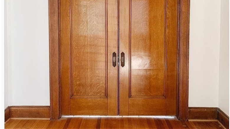 Formal wooden pocket door