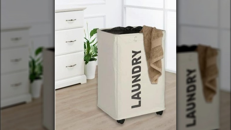 White laundry basket on wheels