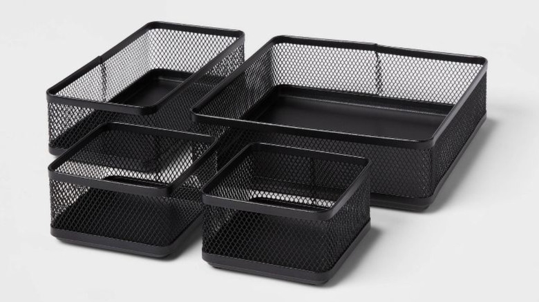 four black mesh drawer organizers