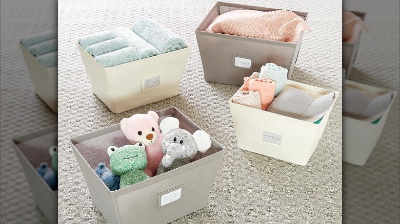 toys and towels in bins