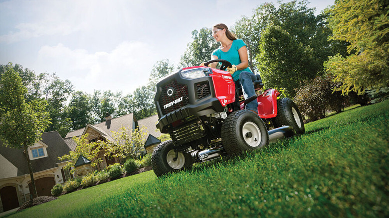 A person riding a Troy-Bilt riding mower