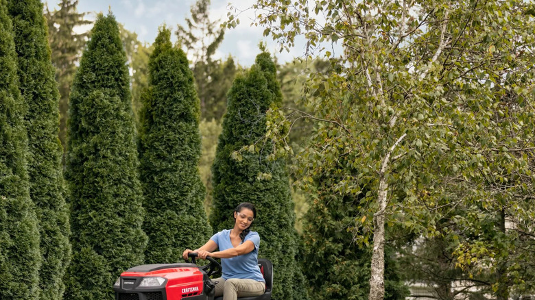 A person riding a Craftsman riding lawn mower