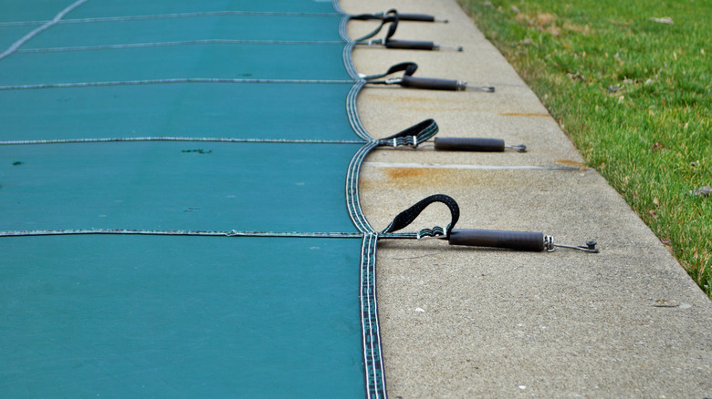 Close-up of pool cover springs