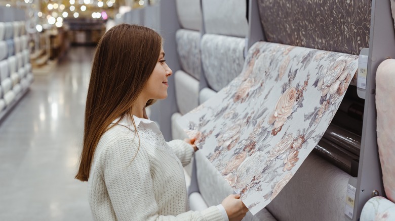 woman picking wallpaper