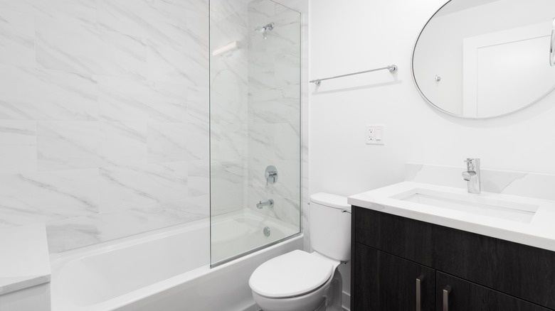 granite shower black white bathroom