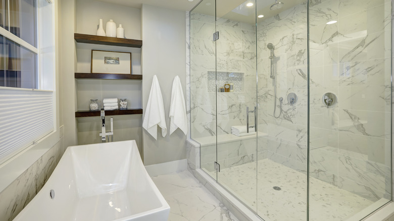 marble shower with glass doors