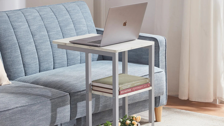 white laptop table with books