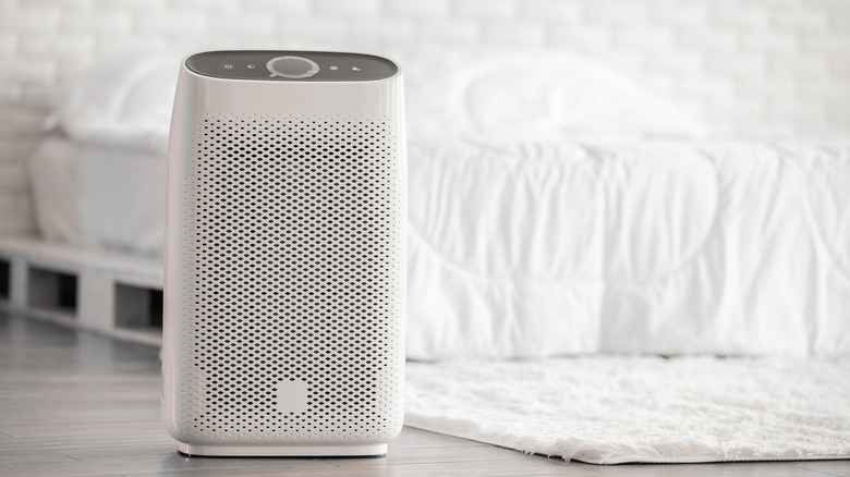 Air purifier inside white bedroom