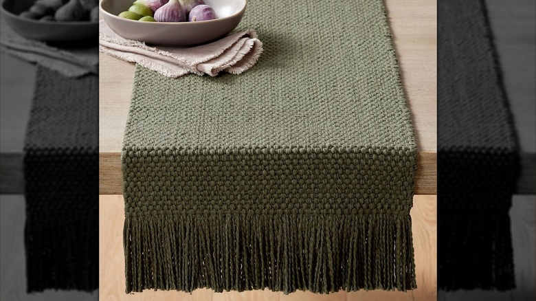 Green table runner on table