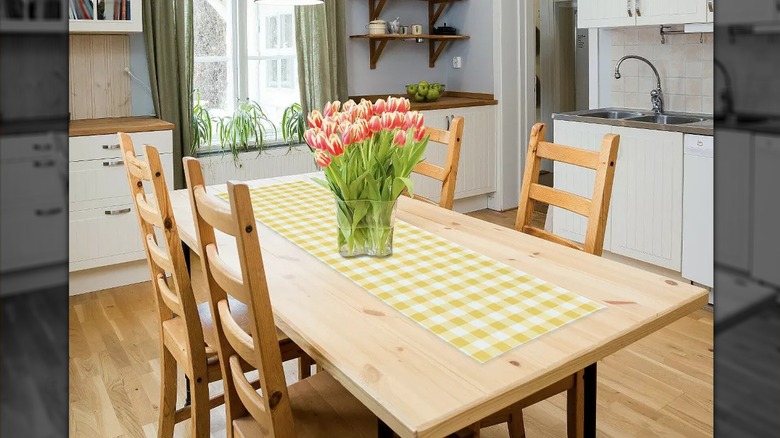 Dining table with yellow plaid runner