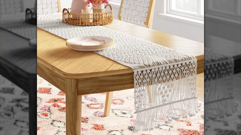 Table with white macramé runner