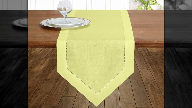 Table with yellow table runner