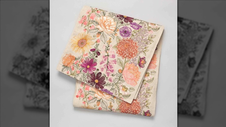 Embroidered floral table runner folded