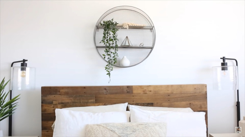 Metal circular shelf in bedroom 