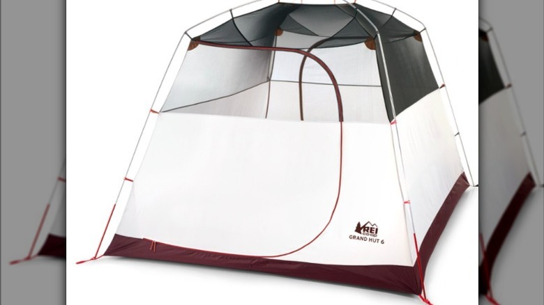 white tent with maroon lining 