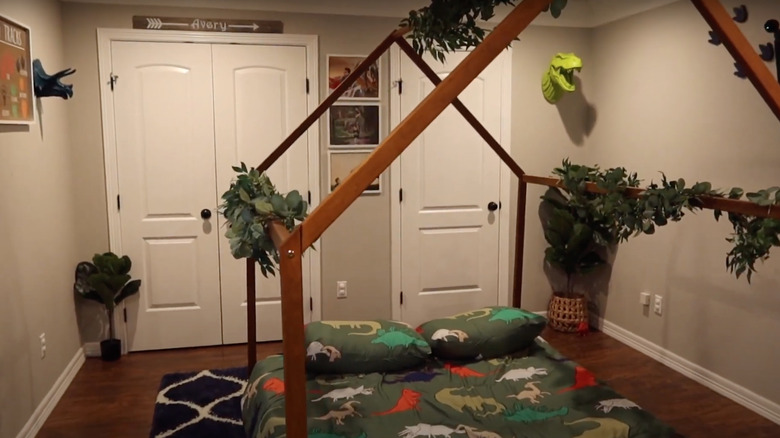 kids room with dinosaurs canopy