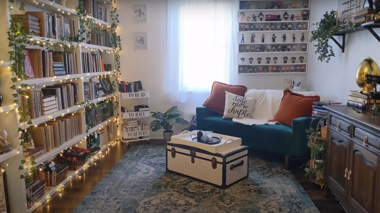 bedroom with bookcases and books