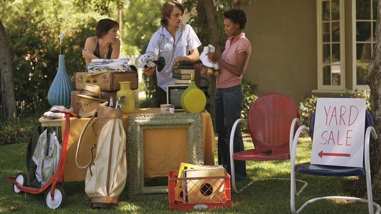 people haggling at yard sale