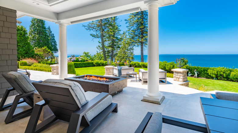 Chairs and fire overlooking ocean