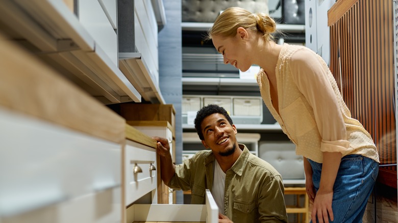 Couple looking at dresser