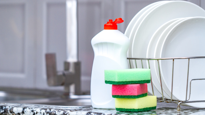 stack of sponges near sink