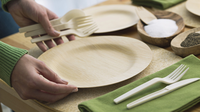 setting table with cloth napkins