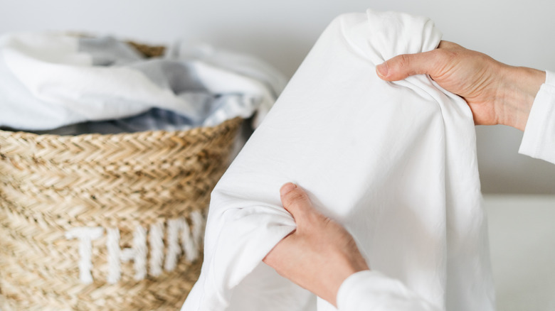 Person holding towel