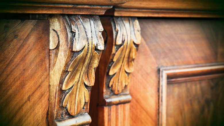 Leaf detailing on wood furniture