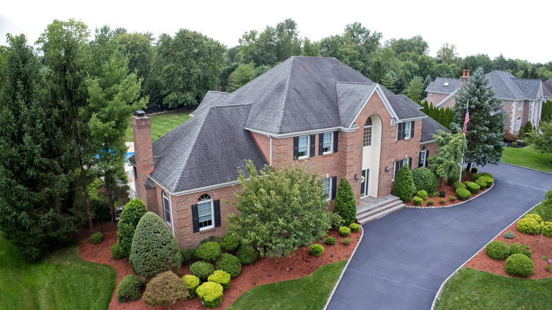 home with trees in landscape