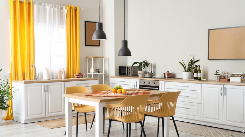 Yellow kitchen curtains in modern kitchen