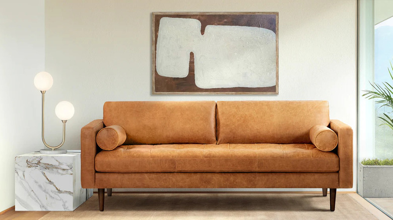 Tan leather couch in living room