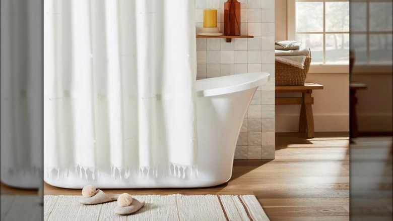 Bathroom with white shower curtain