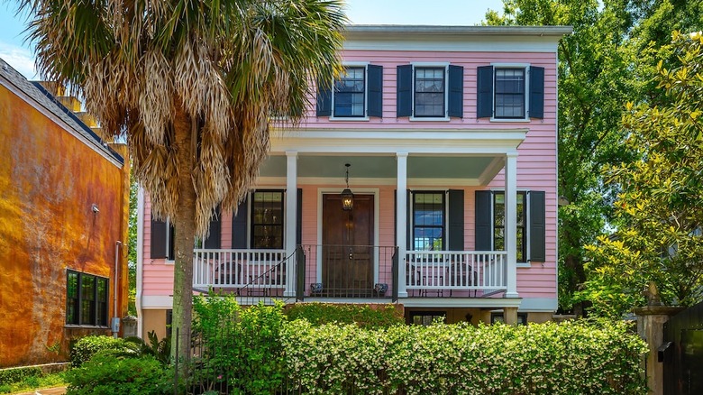 pink two-story house with shutters 