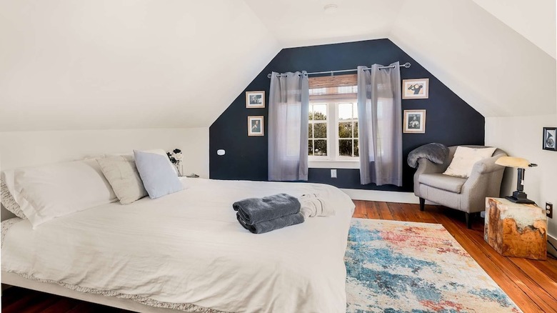 white bed with blue wall 