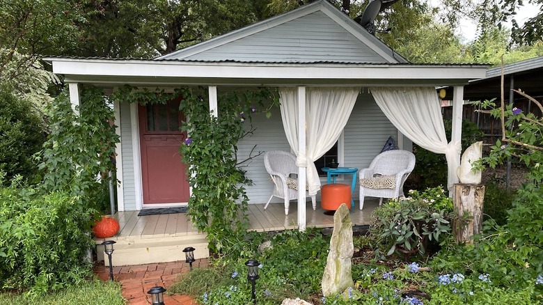 cute light blue cottage with garden