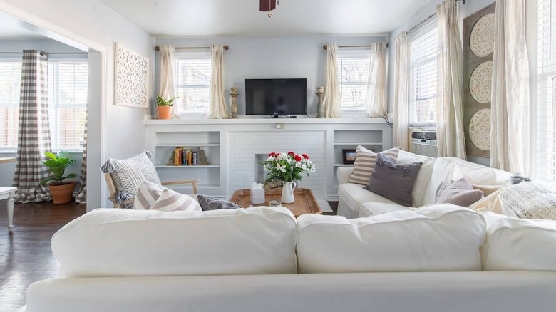 bright living room with white furniture 