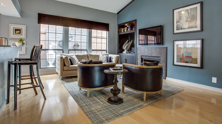 blue living room with leather chairs 