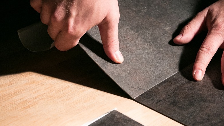 installing dark peel-and-stick floors