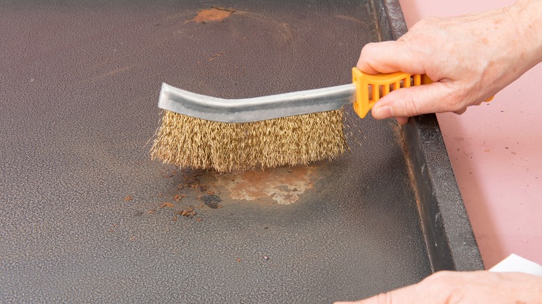 cleaning surface with wire brush