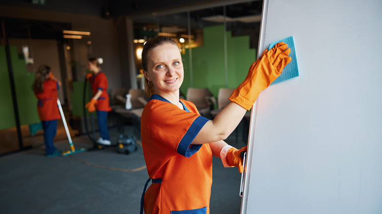 woman cleaning conference room