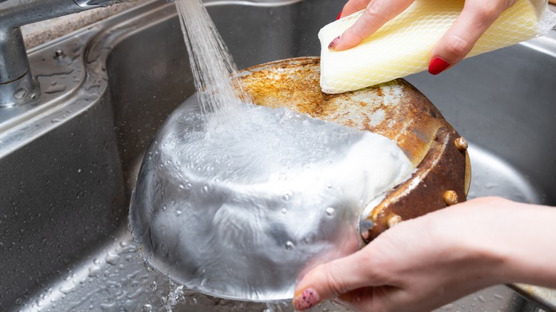 Hand washing dirty pan