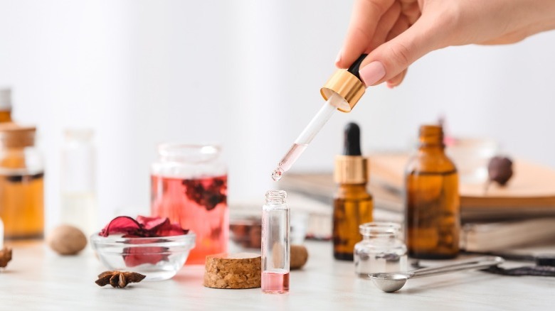 Woman mixing essential oils