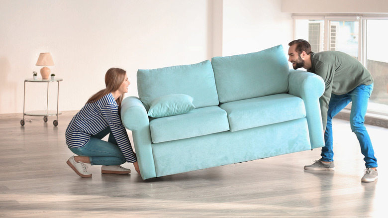 couple moving sofa