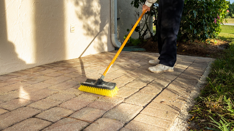 Sweeping brick pavers