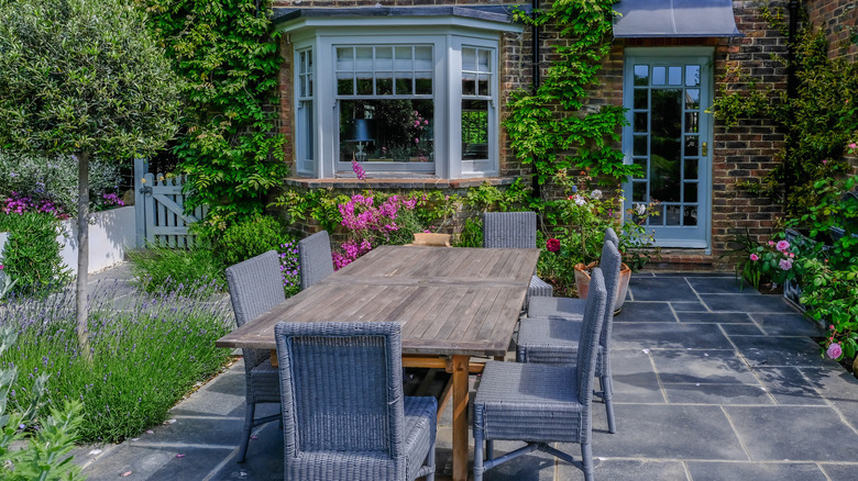 outdoor dining set on slate patio