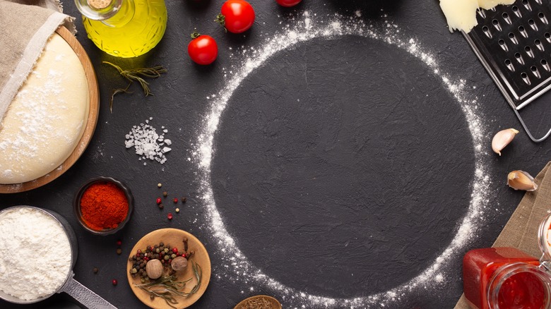 pizza makings on slate countertop