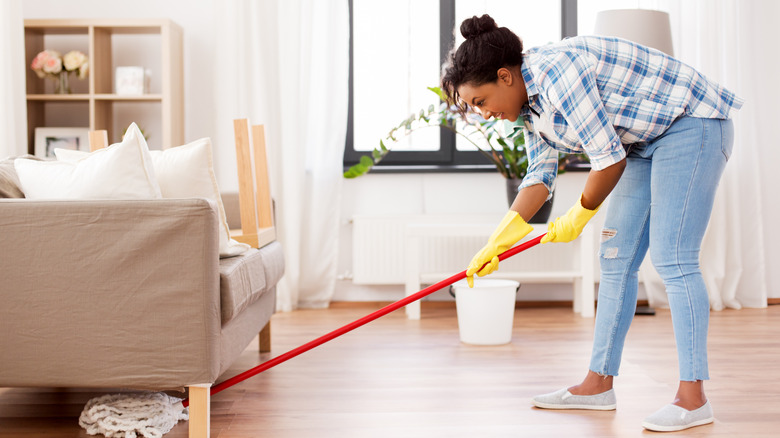 Mopping under couch