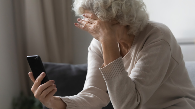 upset older woman on phone